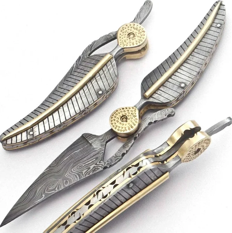 Handmade Damascus Steel Folding Knife with Feather Look and Bronze Accents Handmade Damascus Steel Folding Knife with Feather Look and Bronze Accents